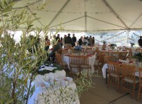 A large tent with many tables and chairs